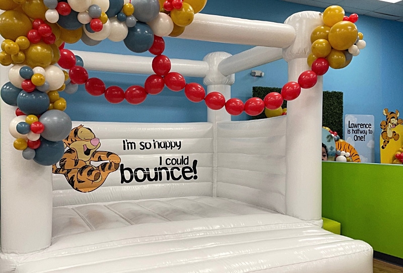 Transform your Kidz Kastle party venue with our Cloud Nine Bounce House rental! Measuring 13ft x 13ft, this pristine white bouncer adds excitement to any event. Kids can enjoy bouncing fun while immersed in interactive games projected onto the bounce house. Enhance your party atmosphere with customizable balloons or vinyl to match your theme perfectly. Book now to elevate your kids' private party experience!