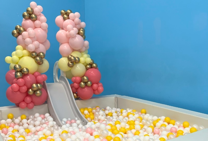 Transform your kids party with our exhilarating icy ball pit and slide! Dive into a world of fun with white balls and vibrant accent colors. Elevate the excitement by adding a custom slide arch to match your theme perfectly. Make your event unforgettable – upgrade now!