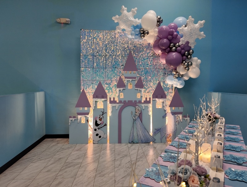 Frozen kids party setup with snowflake decor at Kidz Kastle, Rhode Island’s top birthday party venue.